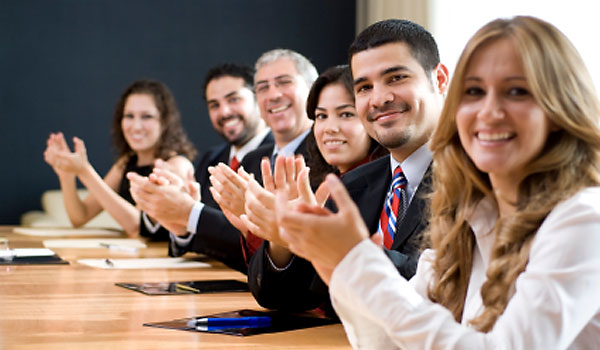 Photo of happy business people at Conference room Table